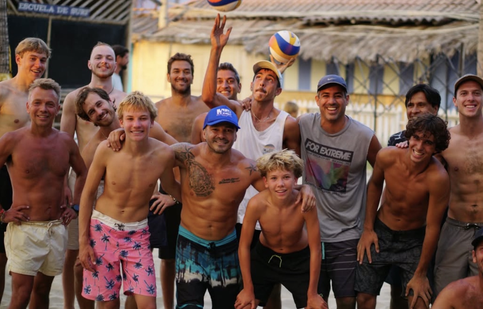 The whole crew together on the sand after a session
